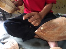 Painting and decorating is a part of the mask-making process. The first stage in the process is choosing the wood, carving the mask and then adding decorations. JP/ Ganug Nugroho Adi
