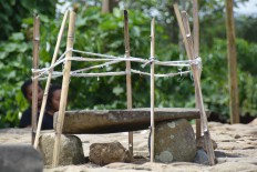  A quadrated stone is used as a place to hold offerings for the ancestors in Bangka Tuke village in Manggarai, East Nusa Tenggara, during the Congko Lokap ritual that took place on April 4. The Jakarta Post/Markus Makur