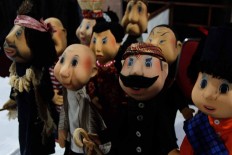 Suyadi’s 1980s puppet icon Si Unyil is displayed at the Gunungan International Mask and Puppets Festival. The Si Unyil puppet show was a famous Indonesian TV series for children running from the early 1980s to 1993. [JP/Arya Dipa]