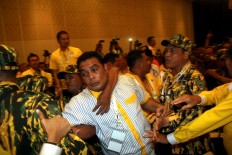 Richad Reibo, a representative from North Maluku, is driven out of the congress venue by security guards amid chaos resulting from a dispute between two contesting camps in the party.  JP/Zul Trio Anggono