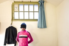 In this Tuesday, April 26, 2016 photo, a gay Moroccan migrant, who prefers not to have his name mentioned, poses for a picture inside his room at the former prison of De Koepel in Haarlem, Netherlands. With crime declining in the Netherlands, the country is looking at new ways to fill its prisons. The government has let Belgium and Norway put prisoners in its empty cells and now, amid the huge flow of migrants into Europe, several Dutch prisons have been temporarily pressed into service as asylum seeker centers. AP Photo/Muhammed Muheisen
