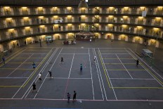In this Tuesday, May 10, 2016 photo, refugees and migrants play football at the former prison of De Koepel in Haarlem, Netherlands. With crime declining in the Netherlands, the country is looking at new ways to fill its prisons. AP Photo/Muhammed Muheisen

