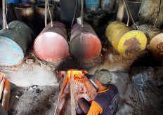 A worker checks the heat to ensure perfect distillation. JP/ Ganug Nugroho Adi
