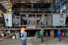 Workers complete the 10514 PKR, which was jointly built by PAL Indonesia and Dutch shipbuilder Damen Schelde Naval Shipbuilding [DSNS] in Surabaya on Aug. 14, 2015. JP/Wahyoe Boediwardhana