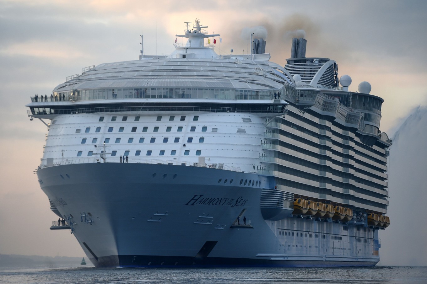 The world's largest passenger cruise ship, Harmony of the Seas, owned by Royal Caribbean, docks on arrival in Southampton, England, Tuesday May 17, 2016, ahead of her maiden cruise. After 32-months being fitted out in a French shipyard the 16-deck Harmony of the Seas will set out on its inaugural voyage on May 22 bound for Barcelona, Spain. 