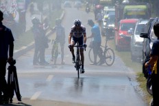 A cyclist approaches a wet section of the track during the final stage of the Tour de Flores in Labuan Bajo. The Jakarta Post/Markus Makur