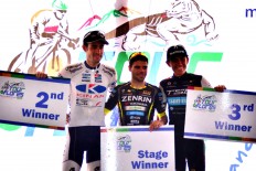Tour champion Daniel Whitehouse (center), runner-up Benjamin Prades (right) and third winner Ricardo Garcia pose for a photo during the prize-awarding ceremony of the Tour de Flores. The Jakarta Post/Markus Makur
