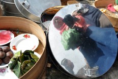 Snacks and cakes are arranged neatly inside tenongs, containers made of aluminum or bamboo. The Jakarta Post/ Albertus Magnus Kus Hendratmo