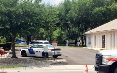 Authorities work in a rear parking area of the Pulse nightclub, Sunday, June 12, 2016, in Orlando, Fla. A gunman wielding an assault-type rifle and a handgun opened fire inside a crowded gay nightclub early Sunday, killing at least 50 people before dying in a gunfight with SWAT officers, police said. It was the worst mass shooting in American history. AP Photo/Jason H. Dearen
