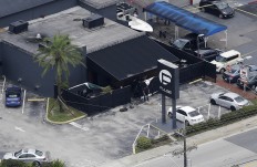 Law enforcement officials work at the Pulse Orlando nightclub following a fatal shooting Sunday, June 12, 2016, in Orlando, Fla. AP Photo/Chris O'Meara
