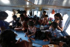 Children undergo medical checks with Indonesian authorities. The Jakarta Post/Hotli Simanjuntak