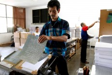 A braille Quran is made using a printing machine donated by Helen Keller International, which ordered six to be given to developing countries. The machine in Bandung is the only one still running. JP/Arya Dipa