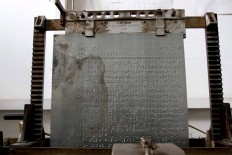 A stereotype machine writes braille script on a zinc plate that is used in the printing machine. JP/Arya Dipa