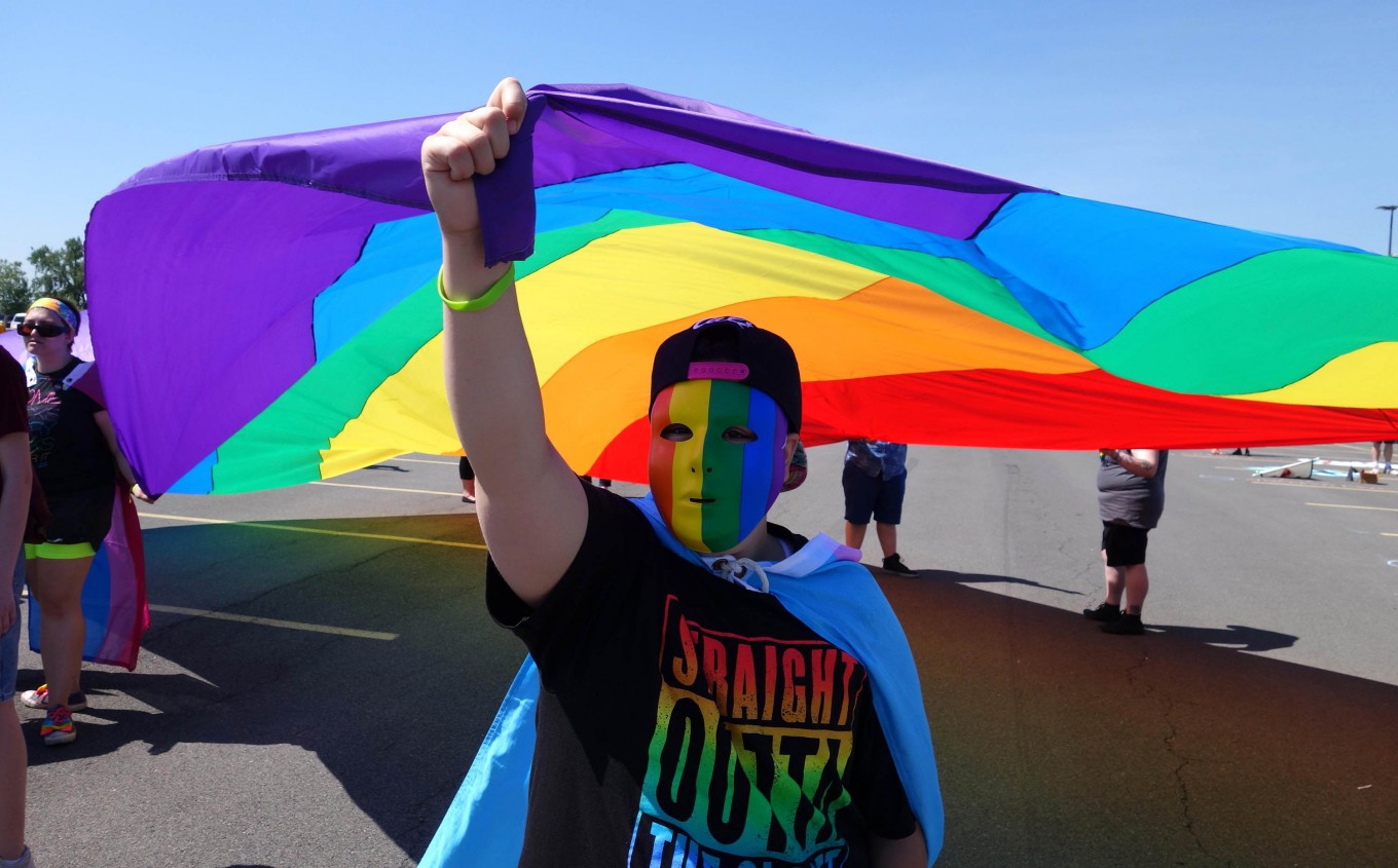 Rainbow flags, images of shooting victims at pride parades 