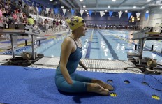 In this Thursday, June 30, 2016 photo, Bryce Ballinger moves along the pool deck during warm-ups in the U.S. Paralympics team trials in Charlotte, N.C. AP Photo/Chuck Burton