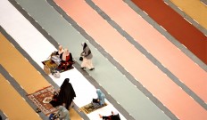Women wait for the Eid al-Fitr prayer service at Honda Center in Anaheim on Wednesday morning, July 6, 2016, in Anaheim, Calif.  More than 5,000 Muslims joined for Eid Mudarak prayers on Wednesday morning. The event was put on by the Islamic Institute of Orange County. Bill Alkofer/The Orange County Register via AP