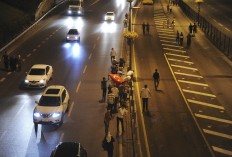 Turkish people, protesting against the coup, walk in Istanbul, early Saturday, July 16, 2016. Turkish President Recep Tayyip Erdogan told the nation Saturday that his government was working to crush a coup attempt after a night of explosions, air battles and gunfire across the capital.  Officials said the coup appeared to have failed as Turks took to the streets overnight to confront troops attempting to take over the country. AP Photo/Omer Kuscu