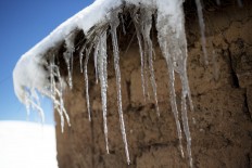 This July 8, 2016 photo shows an alpaca skin on a snow-covered ground, placed there by a villager, in San Antonio de Putina in the Puno region of Peru. Peru's government has declared a state of emergency in the southern Andes and promised $3 million in relief, but locals say promised food and corrals haven't arrived in large enough numbers to protect them from the bone-chilling cold. AP Photo/Rodrigo Abd