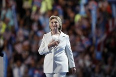 Democratic presidential nominee Hillary Clinton takes the stage to give her acceptance speech during the final day of the Democratic National Convention in Philadelphia , Thursday, July 28, 2016. AP Photo/Paul Sancya