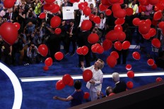 Democratic presidential nominee Hillary Clinton takes the stage to make her acceptance speech during the final day of the Democratic National Convention in Philadelphia , Thursday, July 28, 2016. AP Photo/Paul Sancya