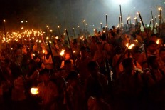 Thousands of students from South Bolaang Mongondow take part in a traditional parade
called taptu to commemorate the 71st anniversary of Indonesia’s independence on the eve of Independence Day on Aug. 16. JP/Lita Evangeline Aruperes