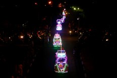 A pedal car waits in a long line for the carnival. JP/Aditya Sagita