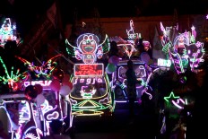 The light decorations make the pedal car carnival shine brightly at nighttime. JP/Aditya Sagita