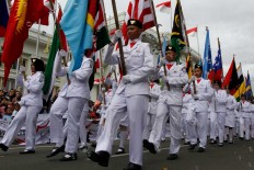 A flag-hoisting team marches carrying 109 flags of countries that were invited to the 60th anniversary of the conference last year. JP/Arya Dipa
