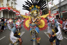 Costume competition participants display a variety of interpretations of the bird theme during the Asia Africa Carnival 2016 on Aug. 14.