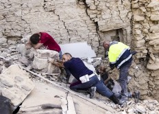 A man cries as another injured is helped in Amatrice, central Italy, where a 6.1 earthquake struck just after 3:30 a.m., Wednesday, Aug. 24, 2016. The quake was felt across a broad section of central Italy, including the capital Rome where people in homes in the historic center felt a long swaying followed by aftershocks. AP Massimo Percossi/ANSA via AP