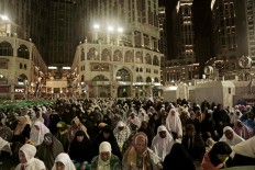 Muslim pilgrims pray the Fajr prayer before sunrise, outside the Grand Mosque in the Muslim holy city of Mecca, Saudi Arabia, Thursday, Sept. 8, 2016. Muslim pilgrims have begun arriving at the holiest sites in Islam ahead of the annual hajj pilgrimage in Saudi Arabia, with some weeping with their hands outstretched for a fleeting touch of the Kaaba. The cube-shaped shrine, at the center of Mecca's Grand Mosque, is the site the world’s 1.6 billion Muslims pray toward five times a day. AP Photo/Nariman El-Mofty