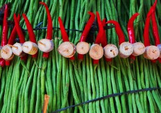 Long beans, red chili and sugar cane are arranged to shape the cone-shaped offerings. JP/Ganug Nugroho Adi
