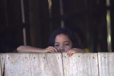 A student from class two, see outside  the class. JP/ Sigit Pamungkas