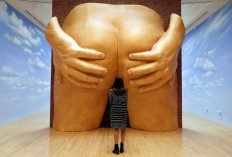 A woman looks towards part of an artwork called 'Lichen! Libido! [London!] Chastity!' by Anthea Hamilton, one of the four artists shortlisted for the Turner Prize 2016, as it is displayed at the Tate Britain gallery in London, Monday, Sept. 26, 2016. The Turner Prize aims to promote public debate around new developments in contemporary British art.  AP Photo/Kirsty Wigglesworth