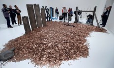 Media gather around part of an artwork by Michael Dean, one of the four artists shortlisted for the Turner Prize 2016, as it is displayed at the Tate Britain gallery in London, Monday, Sept. 26, 2016. The Turner Prize aims to promote public debate around new developments in contemporary British art. AP Photo/Kirsty Wigglesworth
