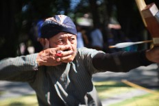 An archer releases his arrow. JP/ Ganug Nugroho Adi