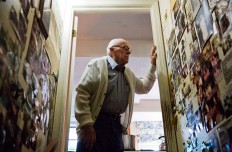 Frank Gleason, 96, a retired colonel with the Office of Strategic Services, looks over memorabilia decorating a wall in his home in Atlanta, Wednesday, Sept. 28, 2016. Legislation to recognize the contributions of a group of World War II spies is hung up in Congress. Some 75 years ago, the OSS carried out missions behind enemy lines in Nazi Germany and the Pacific theatre. Gleason's group was tasked with halting the Japanese advance into China. Gleason and his comrades did this by detonating bridges, railroad tracks and anything else. 'We just blew stuff up left and right,' said Gleason. AP Photo/David Goldman
