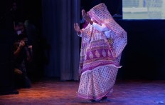 An Indian Hindu widow walks in rhythm during a fashion show in New Delhi, India, Saturday, Oct. 15, 2016. In most of India, millions of Hindu widows are expected to live out their days in quiet worship, dressed only in white. They are typically barred from all religious festivities because their very presence is considered inauspicious. Their lives appear to be changing for better with women's groups and Indian aid organizations taking interest in their welfare. AP Photo/Altaf Qadri
