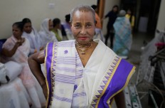 An Indian Hindu widow practices to walk on the runway before a fashion show in New Delhi, India, Saturday, Oct. 15, 2016. Until recently, Indian widows were expected to follow the sociocultural codes of a patriarchal Hindu society that demands a woman lead a life of asceticism after a husband’s death. Their lives appear to be changing for better with women's groups and Indian aid organizations taking interest in their welfare. AP Photo/Altaf Qadri