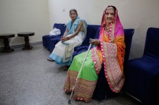 An elderly Indian Hindu widow waits for her turn to walk the ramp during a fashion show in New Delhi, India, Saturday, Oct. 15, 2016. In most of India, millions of Hindu widows are expected to live out their days in quiet worship, dressed only in white. The widows are now breaking age-old traditions of staying aloof by actively participating in Hindu festivals like Holi and Diwali. They went a step further on Saturday, participating in a fashion show. AP Photo/Altaf Qadri
