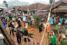 The organizers of the event prepared at least two tons of tomatoes that were too rotten for sale. JP/Arya Dipa