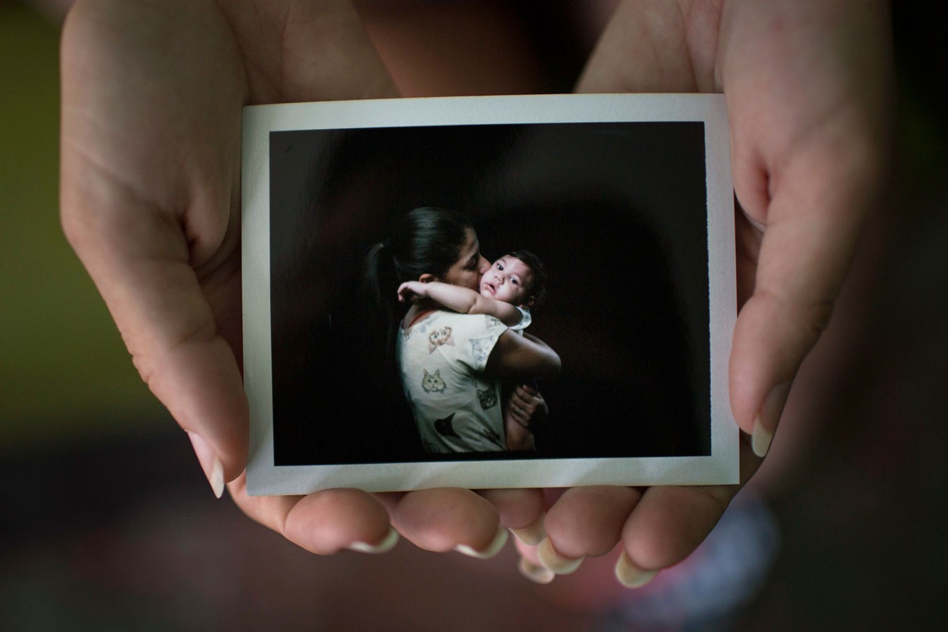 Family portraits of babies disabled by Zika