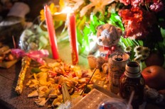 A canang, an offering by Balinese Hindus comprises beer and flowers at the Ground Zero monument on Oct. 12. JP/Anggara Mahendra
