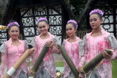 Sindangbarang girls carry water stored in bamboo. They collect it from seven springs and later place it in a large container. Religious leaders will bless the water in the hope it can bring good fortune for the people of the village. JP/Theresia Sufa