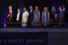 President-elect Donald Trump, left, followed by his family arrives at his election night rally, Wednesday, Nov. 9, 2016, in New York. AP Photo/Mary Altaffer
