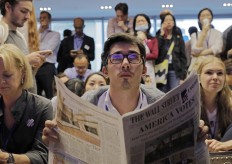 A man reacts as they watch a television broadcast of U.S. election in Hong Kong, Wednesday, Nov. 9, 2016. The United States headed for the polls to vote for their new president on Tuesday. AP Photo/Vincent Yu