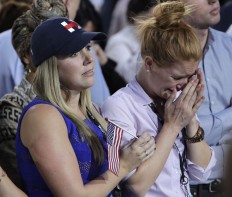 A woman weeps as election results are announced during Democratic presidential nominee Hillary Clinton's election night rally in the Jacob Javits Center glass enclosed lobby in New York, Tuesday, Nov. 8, 2016. AP Photo/Frank Franklin II