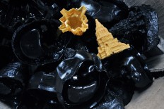 Figurines made from black resin will be sprayed with dark paint while the cream-colored ones with colored paint. JP/Magnus Kushendratmo