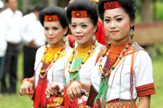 Colorful: Women of Toraja showcase their traditional costume when welcoming guests. JP/ PJ Leo