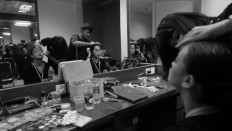 Two dancers get ready in hair and makeup before a press preview at Teater Besar on Dec. 1.
